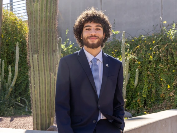 guy standing in front of cactus