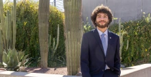guy standing in front of cactus